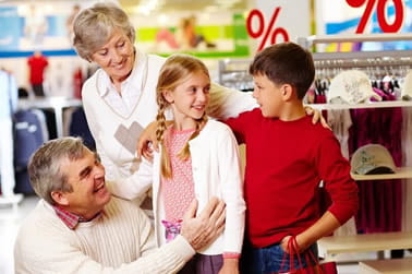 Children with grandparents shopping